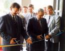 1995 Mayor Dr. Peter Seifert (centre) opens the new TCC premises.